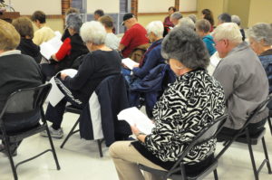 Forum attendees read through the aquatic center assessment packet.  
