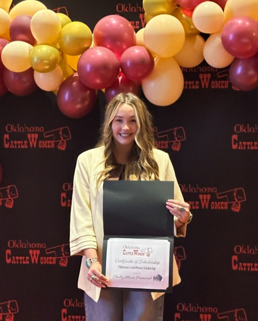 Prenny receives her scholarship at the OCW State Conference